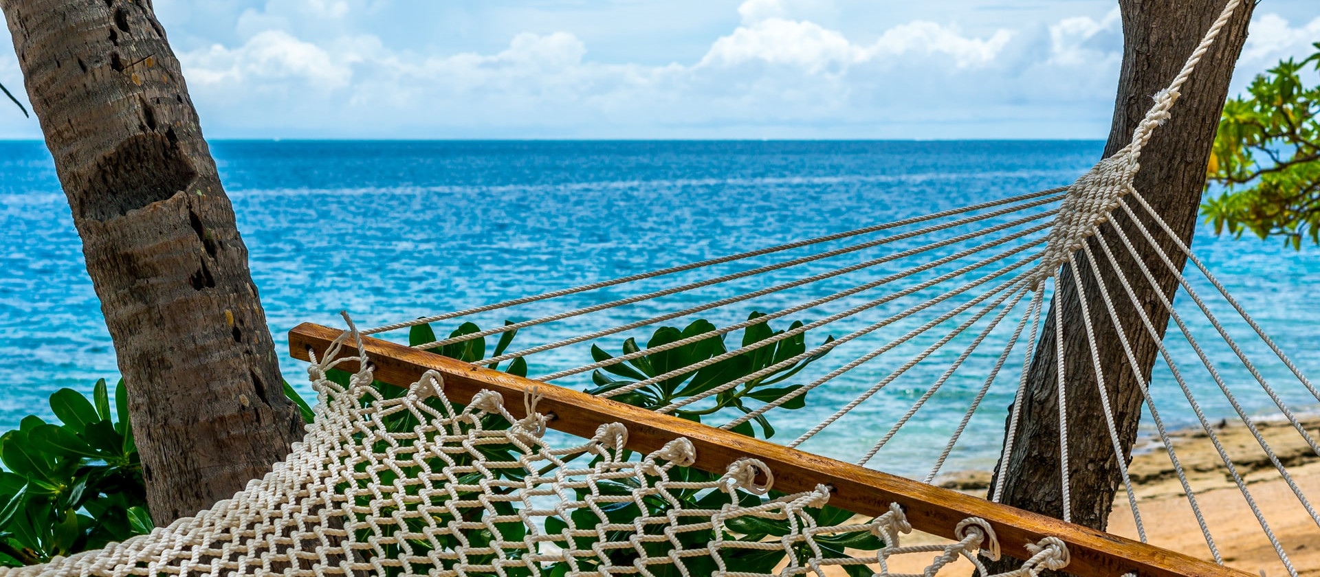 Hammock tied to tree, Malolo Island, Fiji