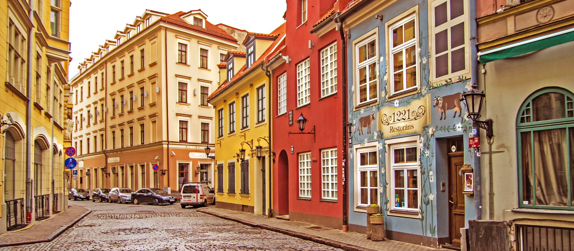 Street with colorful shops and houses in Riga, Latvia
