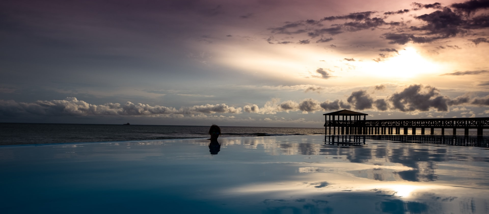 Woman in an infinity pool in São Tomé and Príncipe