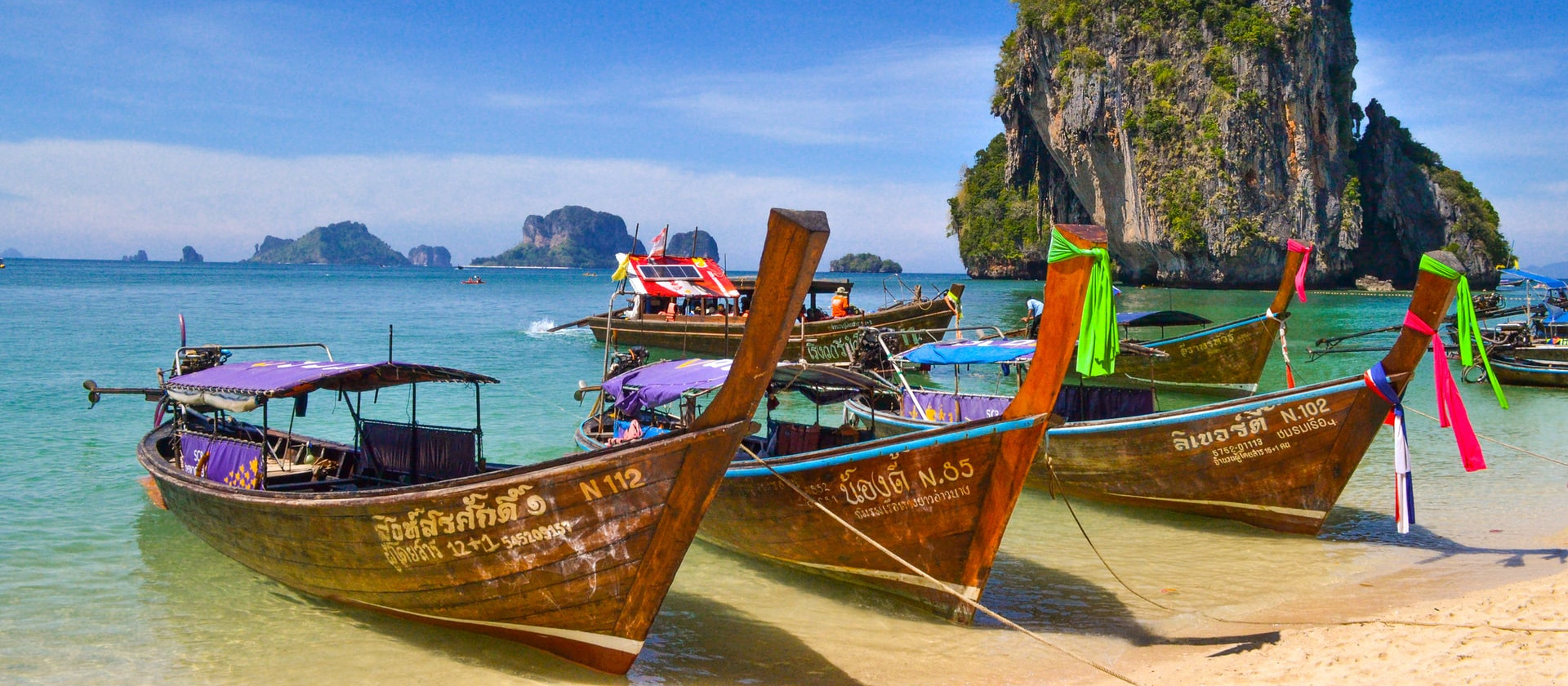 Boats on the shore of Phra Nang Beach, Krabi, Thailand